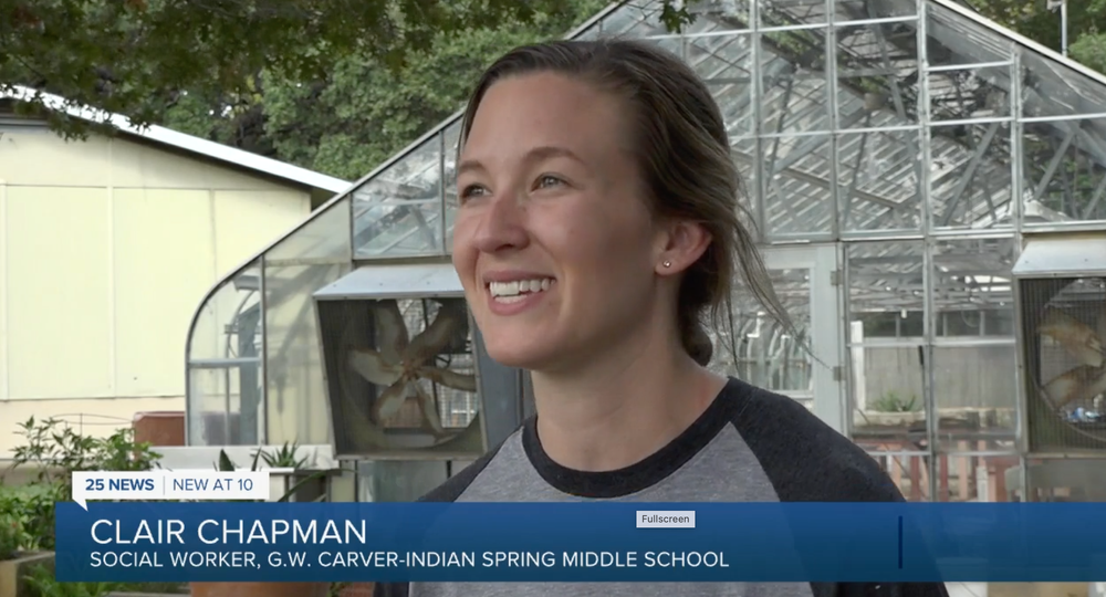 Photo of Clair Chapman being interviewed by the news about creating a student social media club.