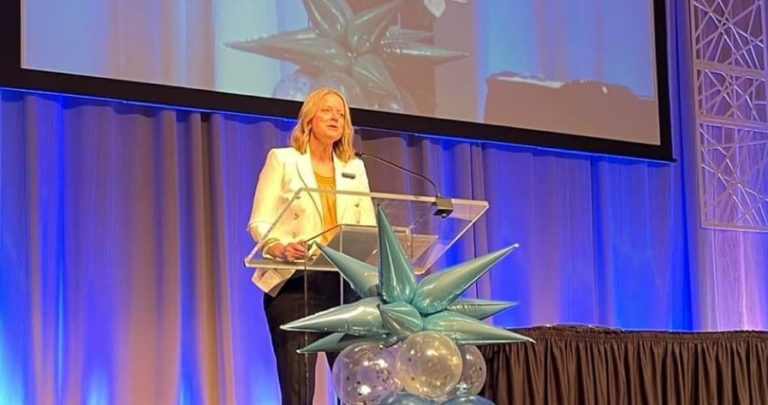 Jill presenting up on stage