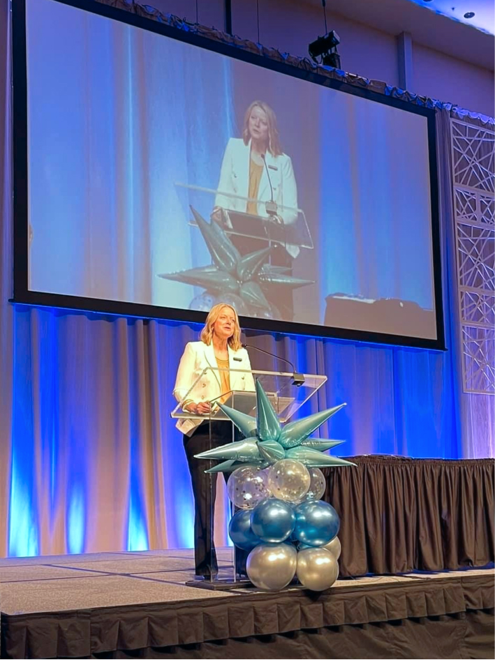 Class Intercom President, Jill, presenting at NETA conference.